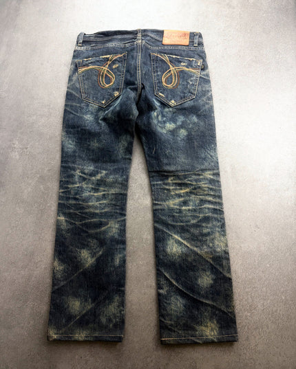 AVH denim back view showing embroidered pockets and heavy honeycomb creasing on the legs
