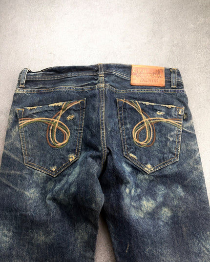 AVH denim back close-up with looping embroidered pockets and A.V.H Costume Denim leather patch