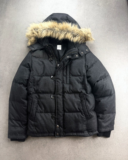 Backnumber charcoal puffer jacket with faux-fur hood laid flat, front view