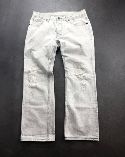 Cult of Individuality ash-grey distressed straight denim laid flat, front view with shredded thigh and knee patches