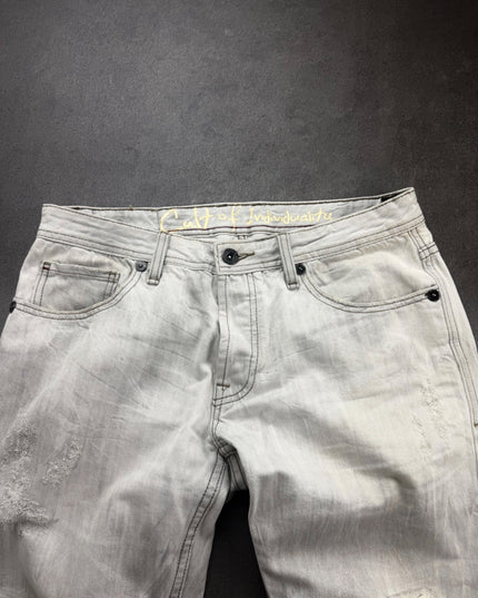 Cult of Individuality denim front close-up of waistband, button fly, dark rivets and contrast stitching
