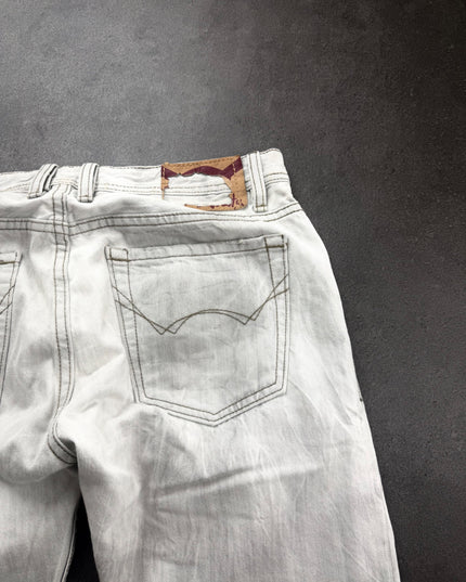 Cult of Individuality grey denim angled view of back pocket, stitching detail and patch on waistband
