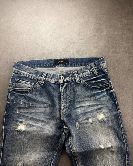 DOWBL denim front close-up showing waistband, button fly, thigh rips and whiskering