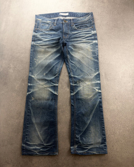 DPSR bootcut denim laid flat, front view with faded thighs and distressing