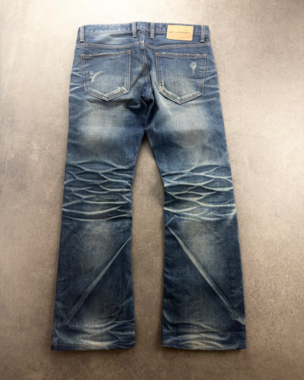 DPSR faded denim laid flat, back view with honeycomb creasing behind the knees