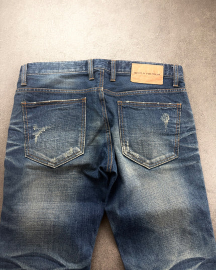 DPSR denim back waist close-up with leather patch and distressed back pockets