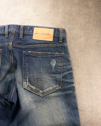 DPSR denim back pocket and leather patch close-up with scratched wash detail