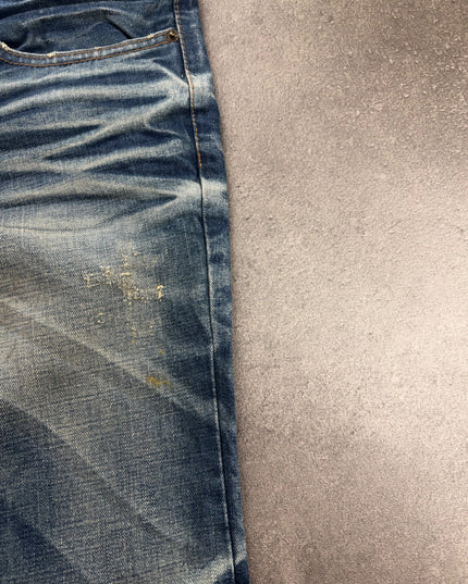 DPSR denim side close-up showing thigh distressing, seam and faded indigo texture
