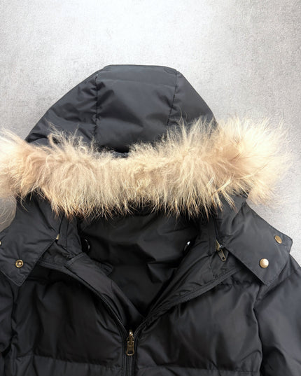 Heisei puffer jacket close-up of fur hood, brass snaps and double zip collar