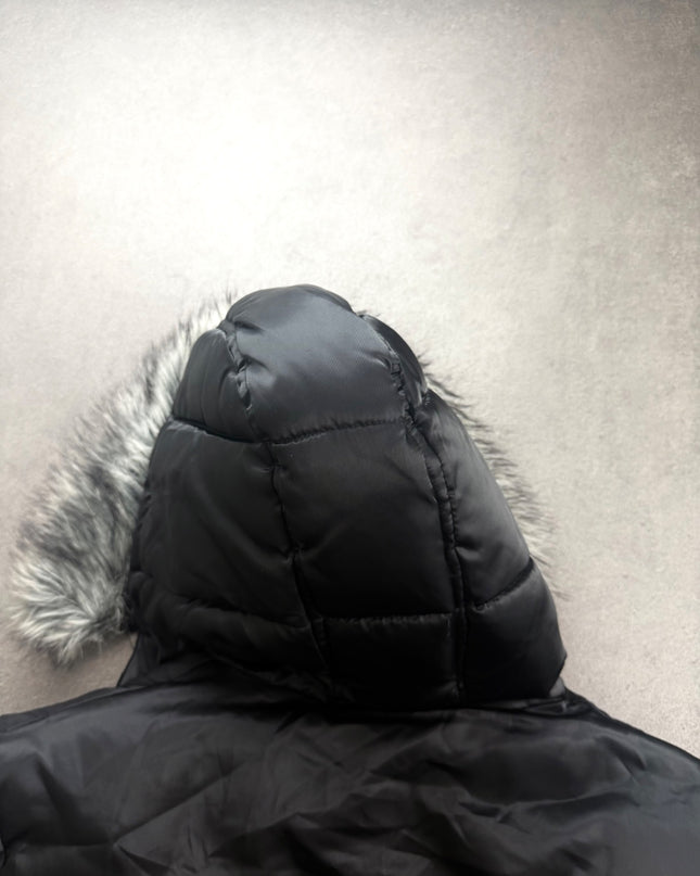 HEISEI puffer jacket hood seen from behind showing quilted panels and fur edge
