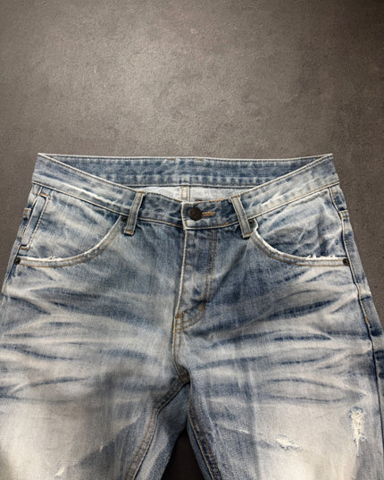 IMPROVES denim close-up of waistband, button, front pockets and streaky whiskering