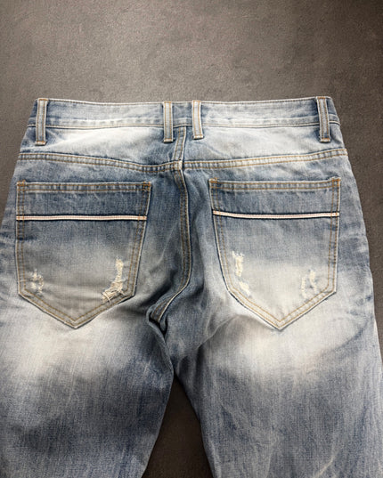 IMPROVES denim back pockets with pale selvedge-style trim and distressed accents