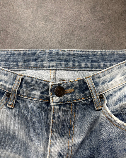 IMPROVES denim close-up of metal button, belt loops and tan contrast stitching