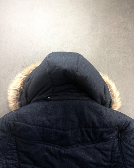 Louis Chavlon puffer jacket hood from behind with fur trim and padded navy shoulders