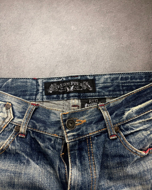 Red Pepper denim waistband close-up with woven brand label and engraved button