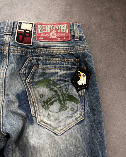 Red Pepper denim back pocket close-up with green eagle print and eagle patch