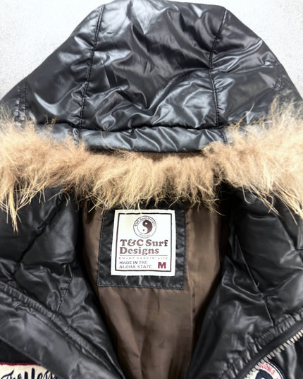 T&C Surf puffer jacket detail of zip pockets and knit cuffs