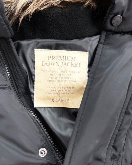 Detail of Takeo Kikuchi puffer jacket ribbed knit cuff and quilted sleeve