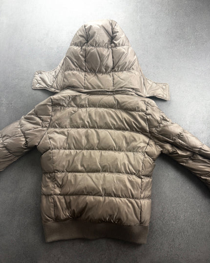UNIQLO quilted puffer jacket back view with snap-button hood laid flat