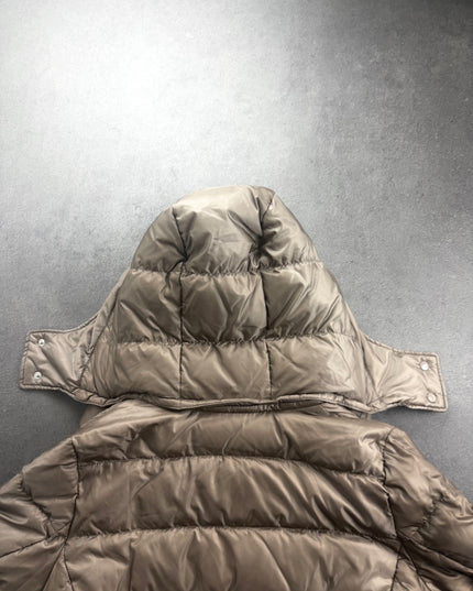 UNIQLO puffer jacket hood and upper back showing padded quilting and snaps