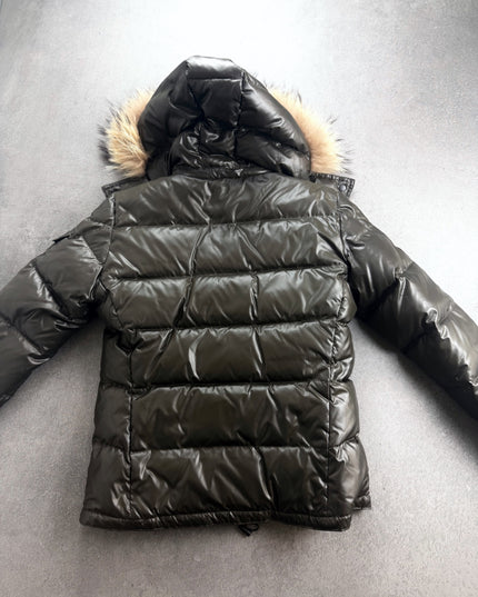 UNTITLED puffer jacket back view showing quilted channels, hood and fur trim